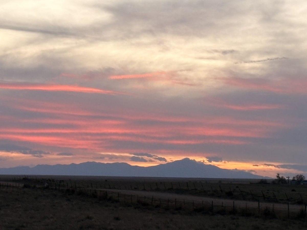 Sunset over the open plains at Winters Ranch in Rush, Colorado